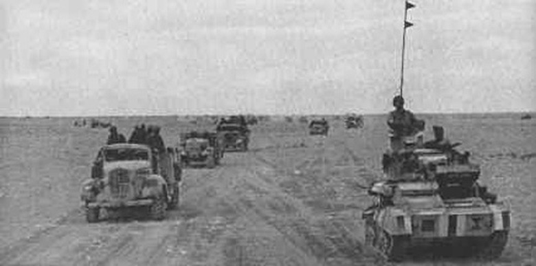 A British column moving across an enemy minefield