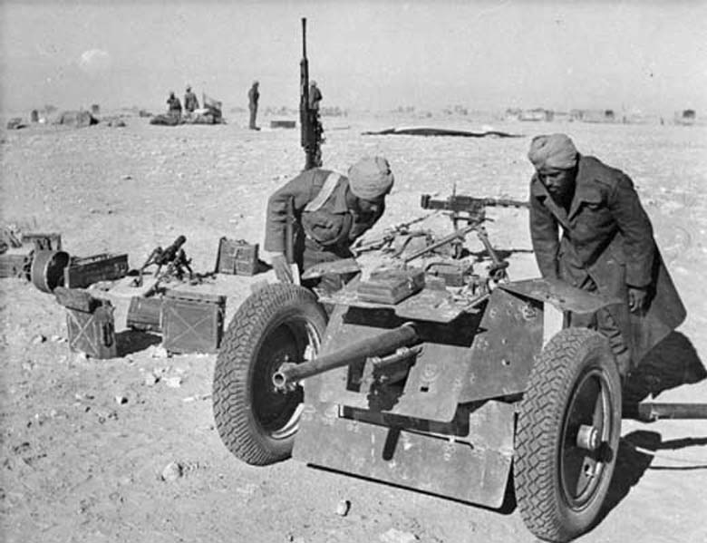 Indian Troops Inspect Captured Gun