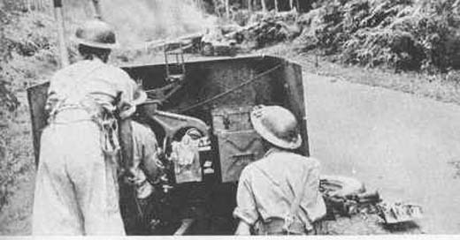 British Anti-Tank Gunners Firing at Enemy Tanks