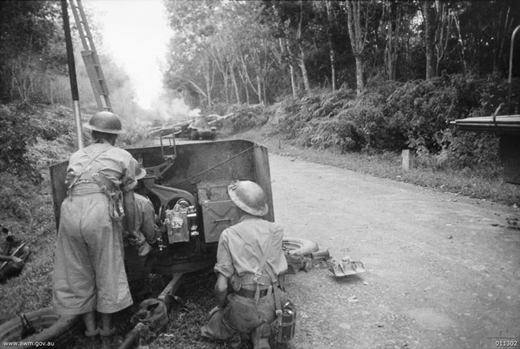 Australian Anti-Tank Gun Firing on Japanese Tanks