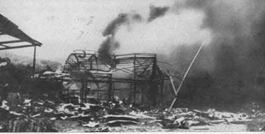 Aifield Hangars Burning at Salamaua