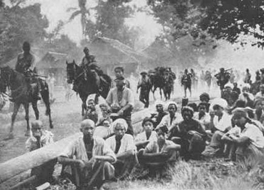 Japanese Troops Passing through a Burmese Village