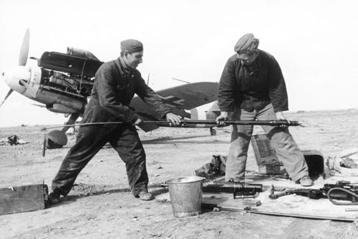 Armorers Are Cleaning the Barrels of an Me-109