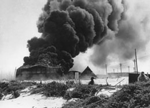 Oil Tank Burning from Japanese Air Raid on Midway