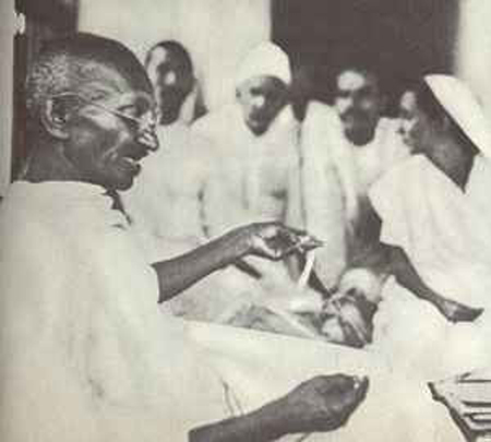 Gandhi Demonstrates Spinning