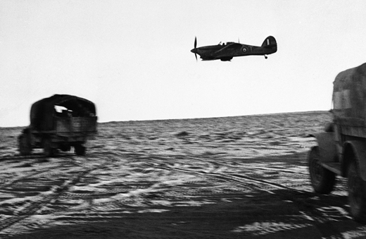 RAF Plane Escorts Trucks of New Zealand Unit