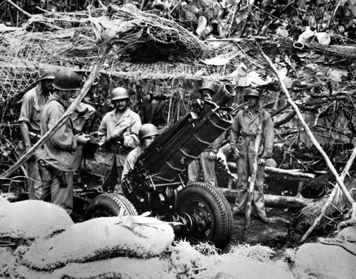 US Marines Man a .75mm Gun on Guadalcanal
