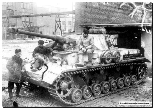 Soviet Soldiers Atop a German Tank