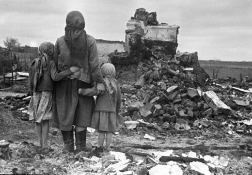 Family Looking at Destroyed Home