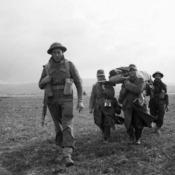 A Soldier Escorts Captured Germans