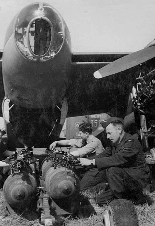 Armourers move the bomb trolley