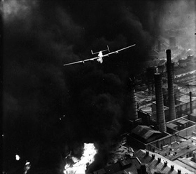 A B-24 Clearing the Stacks of the Astra Romana Refinery