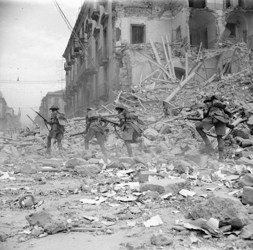 British Troops Scramble over Rubble