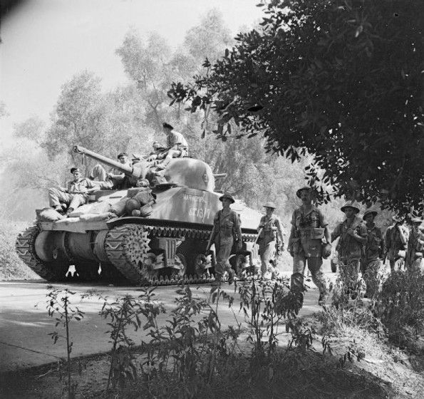 Sherman Tank and Infantry Advance