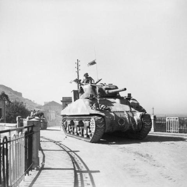 A Sherman Tank Moves Inland at Reggio