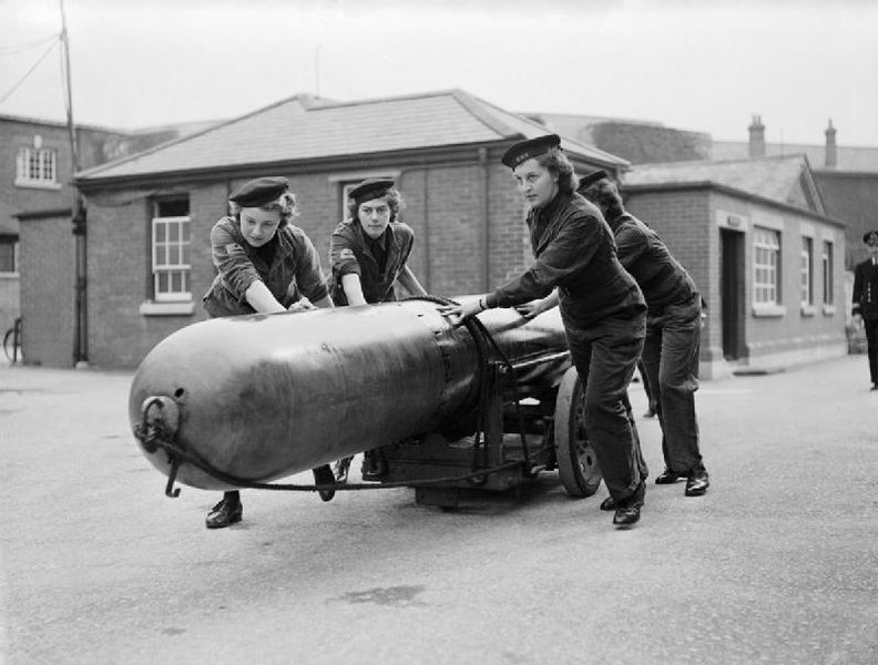 Women's Royal Naval Service Members Move a Torpedo