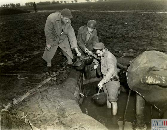 Gun Crew Bailing Out Water