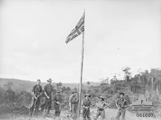 Raising the Union Jack Over Wareo, New Guinea