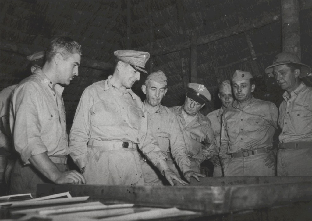 Gen MacArthur Studies a Map