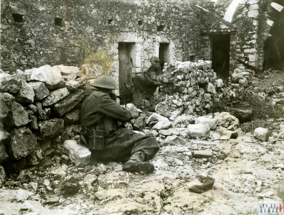 Scottish Soldiers Inspect a House