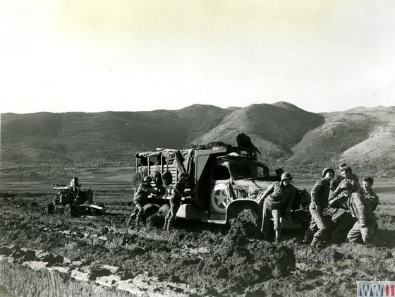 US troops tow an artillery weapon