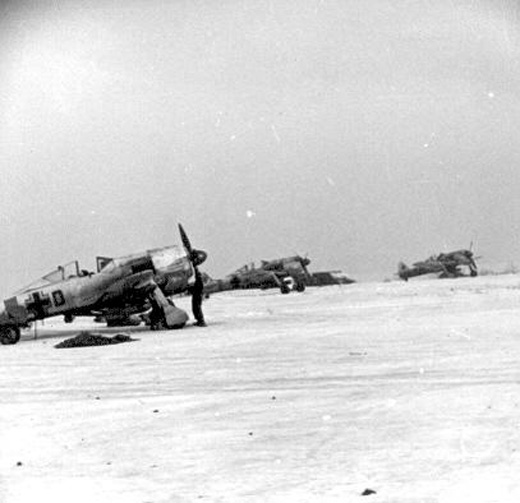 Planes in readiness at frozen airfield