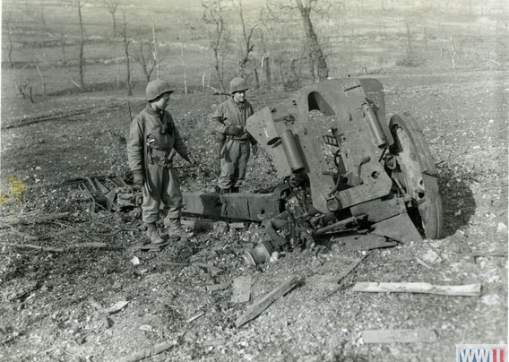 Examining the Remains of German Artillery Weapon