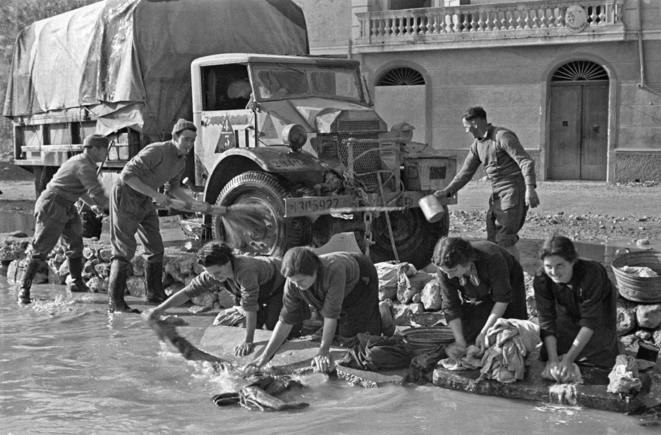 New Zealand Soldiers Cleaning a Truck