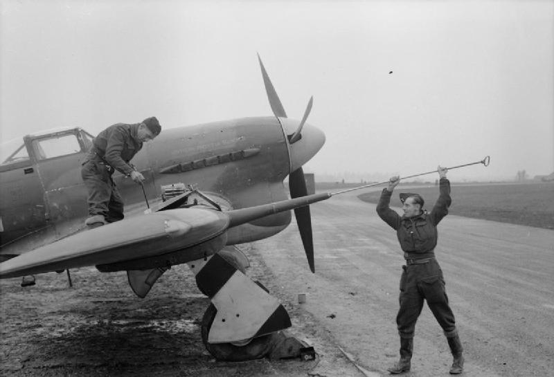 Armorers Clean Out the Cannon of a Typhoon