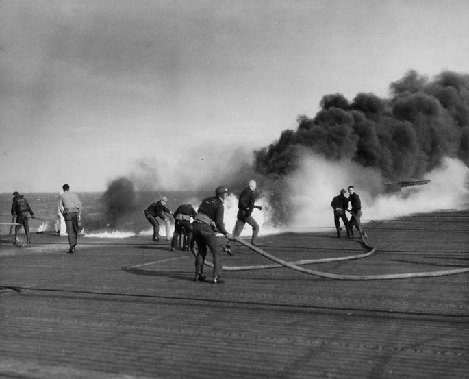 Flight Deck Crewmen Fight the Fire