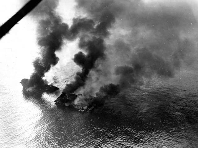 Allied landing craft burning