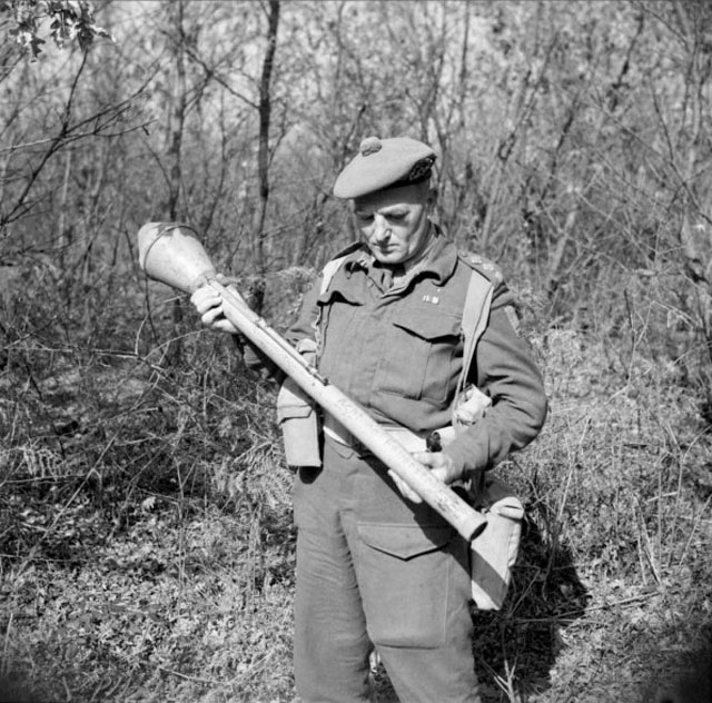 examines a German Panzerfaust