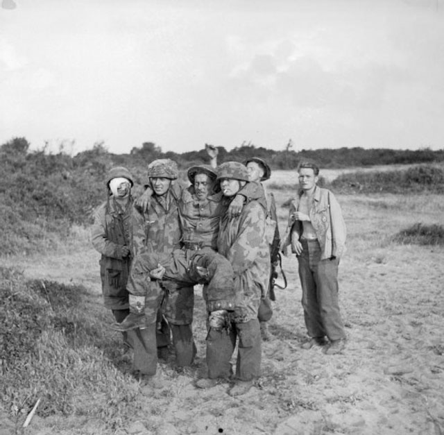 German Paratroopers Carrying a Wounded British Soldier