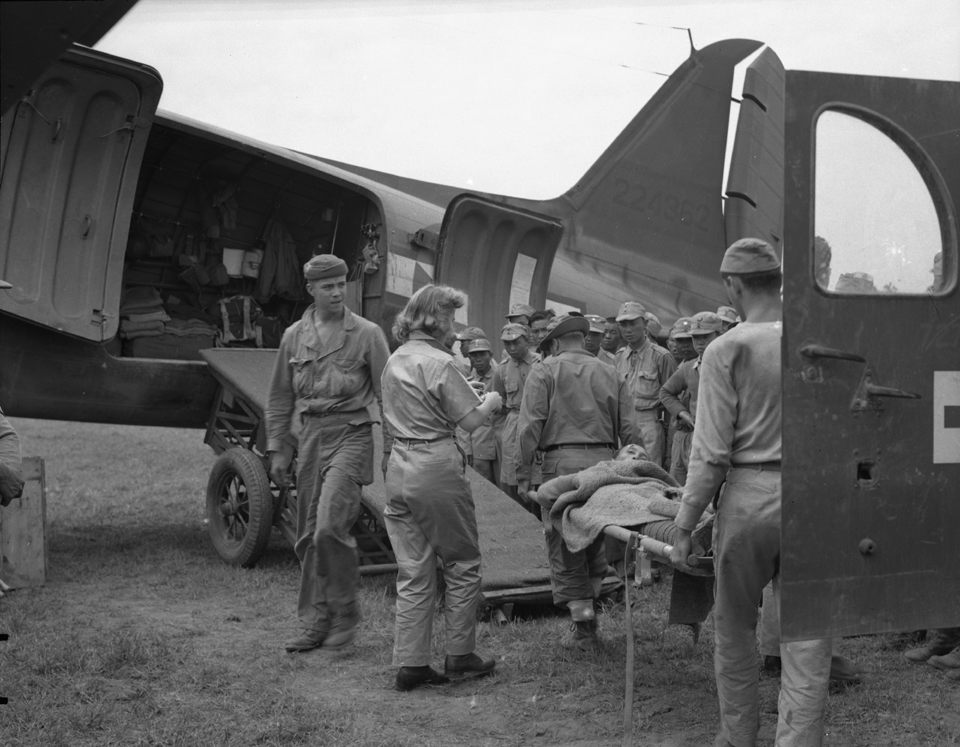 Patients being loaded in ambulance plane