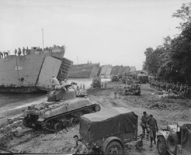 Six US Navy LSTs loading men and equipment