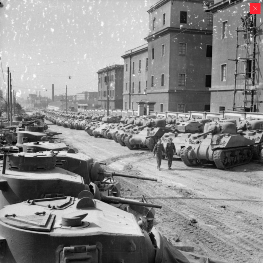 Sherman tanks (right) and Stuarts (left)