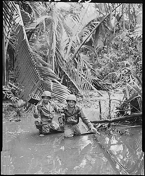 Wading Through a Stream in New Guinea