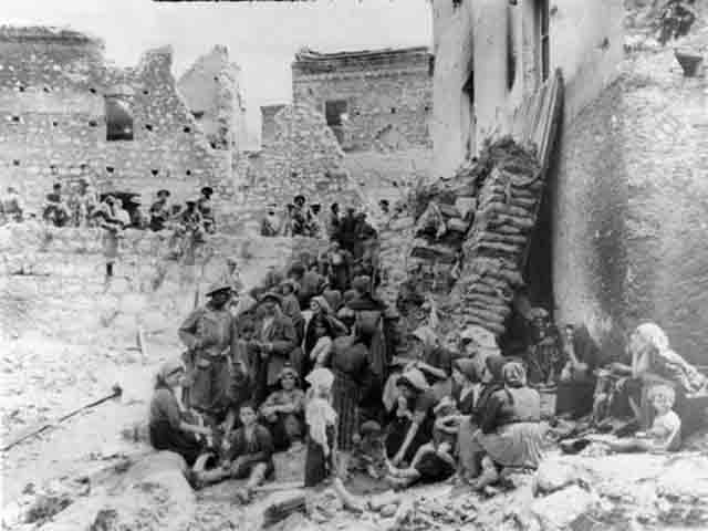 civilians taking refuge near air raid shelter