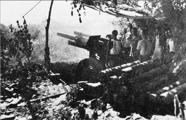 Chinese Crew of a 105-mm Howitzer