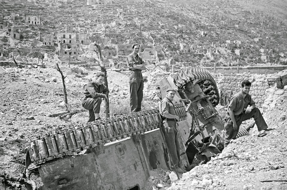 Examining a Knocked Out Sherman Tank