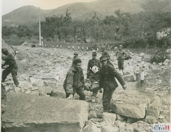 German Prisoners Carrying Wounded Fellow Soldier