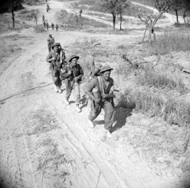 Unidentified Canadian Infantrymen Advancing towards Melfa