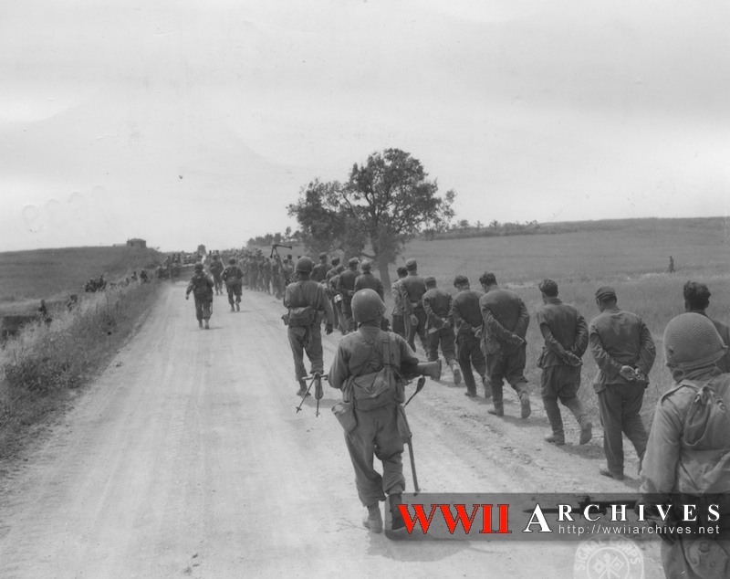 German Prisoners Are Marched Single File