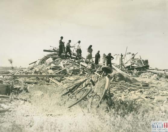 Italian Refugees Survey Damaged Homes