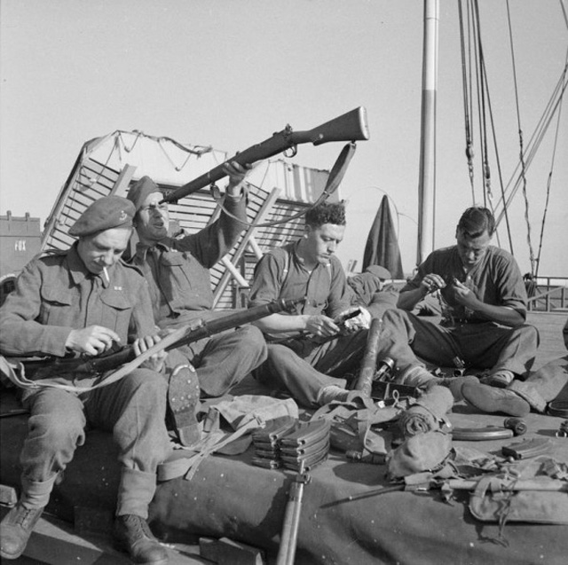 Troops Cleaning Their Rifles