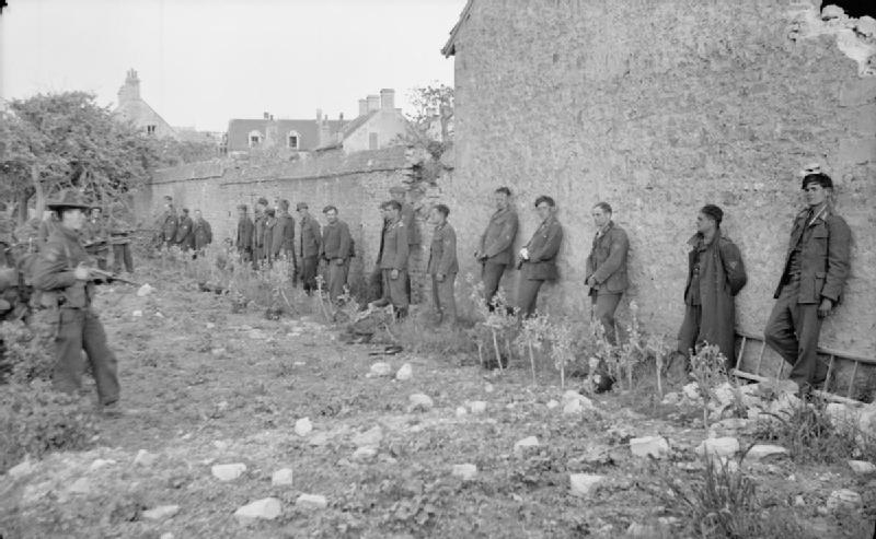 German Prisoners Lined Up Against a Wall