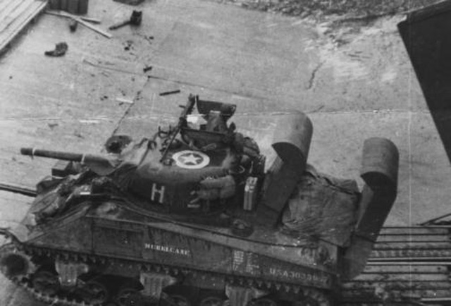 Sherman Tank Rolls onto a Beachhead