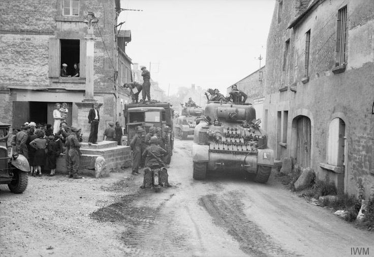 Sherman Tanks Passing Through Reviers