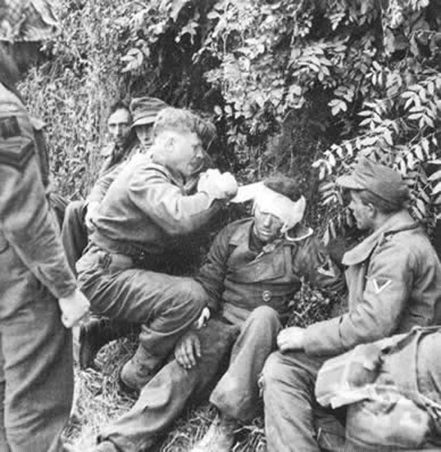 German Soldiers Taking Care of British Soldiers