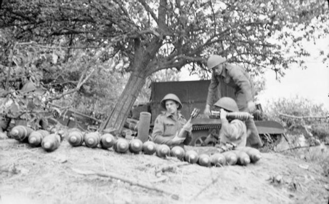 preparing to fire a 4.2in mortar